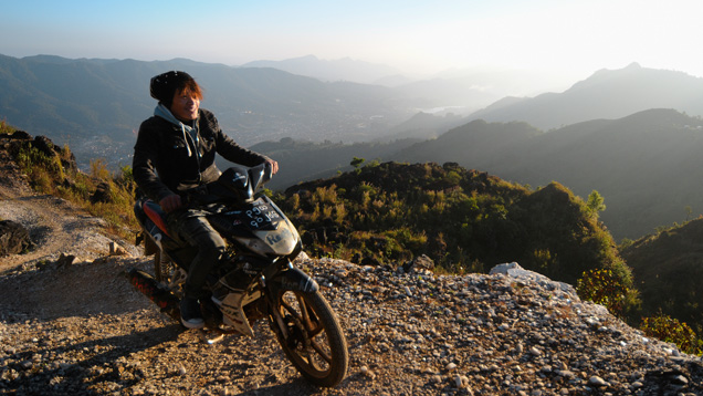 Artisanal miner on motorbike in Myanmar Artisanal miner on motorbike in Myanmar