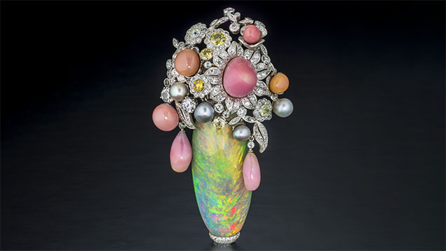 Figure 3. This pin features a 63.92 ct Ethiopian opal with 23.85 carats of conch pearl, 5.88 carats of natural pearl, and 15.85 carats of diamond, set in platinum. Photo by Robert Weldon; courtesy of Pioneer Gems of New York. Figure 3. This pin features a 63.92 ct Ethiopian opal with 23.85 carats of conch pearl, 5.88 carats of natural pearl, and 15.85 carats of diamond, set in platinum. Photo by Robert Weldon; courtesy of Pioneer Gems of New York.