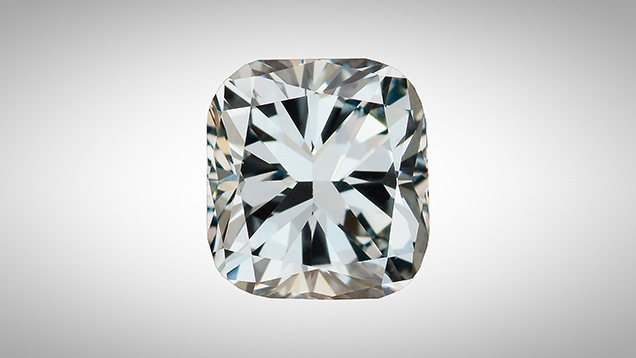 A face-up view of a cushion cut diamond with blue color. A face-up view of a cushion cut diamond with blue color.