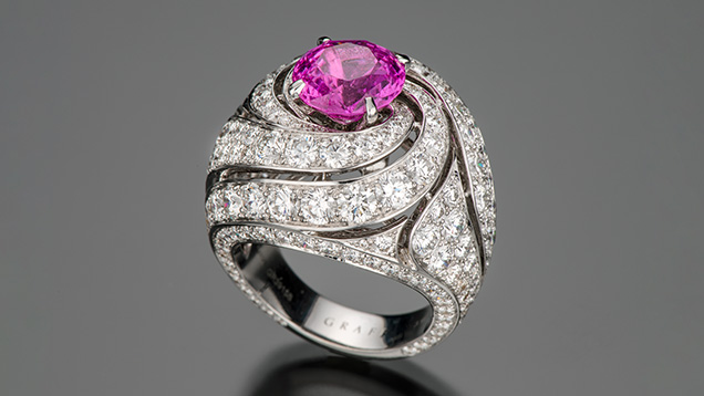 Figure 1. This ring from Graff features a 3.95 ct pink sapphire and 7.5 carats of diamond in a spiral design. Photo by Robert Weldon; courtesy of Jewelerette Co. Figure 1. This ring from Graff features a 3.95 ct pink sapphire and 7.5 carats of diamond in a spiral design. Photo by Robert Weldon; courtesy of Jewelerette Co.