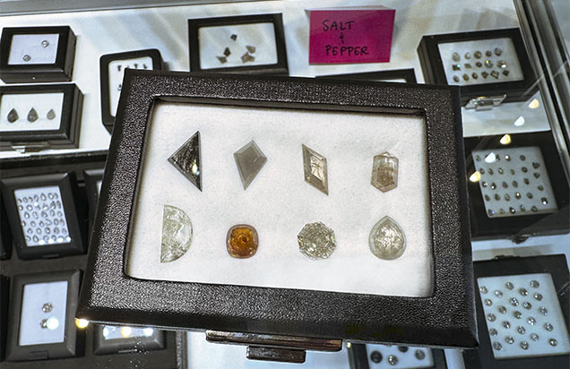 Figure 5. “Salt and pepper” diamonds containing eye-visible inclusions. Photo by Jennifer Stone-Sundberg; courtesy of Misfit Diamonds. Figure 5. “Salt and pepper” diamonds containing eye-visible inclusions. Photo by Jennifer Stone-Sundberg; courtesy of Misfit Diamonds.