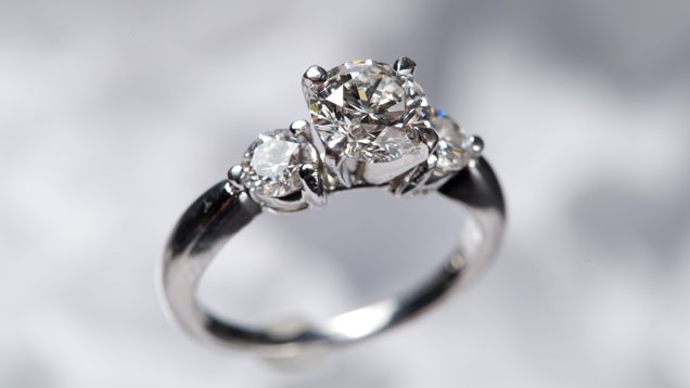 Three stone diamond and platinum ring. Three stone diamond and platinum ring.