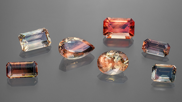Figure 1. Faceted Oregon sunstone crystals (2.75–7.71 ct) representing the variety of colors observed. Photo by Adriana Robinson. Courtesy of the GIA Museum. Gifts of Western Ventures (pear shape), Dust Devil Mining Co. (oval), and John and Laura Ramsey (emerald cut on the far right). Figure 1. Faceted Oregon sunstone crystals (2.75–7.71 ct) representing the variety of colors observed. Photo by Adriana Robinson. Courtesy of the GIA Museum. Gifts of Western Ventures (pear shape), Dust Devil Mining Co. (oval), and John and Laura Ramsey (emerald cut on the far right).