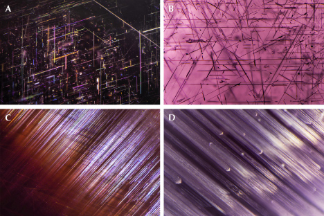Figure 13. A: Rutile needles in star garnet. B: Needle inclusions in star spinel. C: Needle inclusions in cat’s-eye garnet. D: Linear inclusions in cat’s-eye spinel. Photomicrographs by Nathan Renfro; fields of view 3.35 mm (A), 3.38 mm (B), 1.95 mm (C), and 3.09 mm (D). Figure 13. A: Rutile needles in star garnet. B: Needle inclusions in star spinel. C: Needle inclusions in cat’s-eye garnet. D: Linear inclusions in cat’s-eye spinel. Photomicrographs by Nathan Renfro; fields of view 3.35 mm (A), 3.38 mm (B), 1.95 mm (C), and 3.09 mm (D).