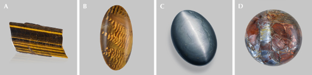 Figure 17. A: A 255 ct polished rectangular slice of tiger’s-eye from South Africa. B: A 22.03 ct tiger’s-eye cabochon from South Africa showing waves due to bent inclusions; courtesy of John I. Koivula. C: A 220 ct hawk’s-eye oval cabochon. D: A 19.82 ct pietersite round cabochon showing chatoyant fragments of different colors. Photos by Emily Lane (A and C) and Annie Haynes (B and D). Figure 17. A: A 255 ct polished rectangular slice of tiger’s-eye from South Africa. B: A 22.03 ct tiger’s-eye cabochon from South Africa showing waves due to bent inclusions; courtesy of John I. Koivula. C: A 220 ct hawk’s-eye oval cabochon. D: A 19.82 ct pietersite round cabochon showing chatoyant fragments of different colors. Photos by Emily Lane (A and C) and Annie Haynes (B and D).