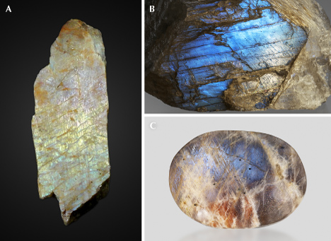 Figure 29. A: A peristerite from Ontario, Canada (7 cm long), showing pink, yellow, and green iridescence; courtesy of GIA Museum, collection no. 32588. B: Clear peristerite from Tanzania (677 g) showing light blue iridescence on the (010) cleavage surface; gift of Lithos Africa. C: A polished peristerite from Tanzania (7.5 cm long) that also displays aventurescence from hematite platelet inclusions; courtesy of Rachelle Turnier. Photos by John Montgomery (A) and Emily Lane (B and C). Figure 29. A: A peristerite from Ontario, Canada (7 cm long), showing pink, yellow, and green iridescence; courtesy of GIA Museum, collection no. 32588. B: Clear peristerite from Tanzania (677 g) showing light blue iridescence on the (010) cleavage surface; gift of Lithos Africa. C: A polished peristerite from Tanzania (7.5 cm long) that also displays aventurescence from hematite platelet inclusions; courtesy of Rachelle Turnier. Photos by John Montgomery (A) and Emily Lane (B and C).