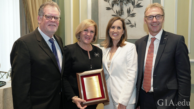 alt="Susan Jacques accepted the Stanley Schechter Award at the Jewelers Vigilance Committee (JVC) luncheon on Jan. 10, 2020. From left: Joel Schechter, retired CEO of Honora; Susan Jacques, GIA president and CEO; Tiffany Stevens, JVC CEO and general counsel; and Charles Stanley, president of Forevermark US and 2020 Chairman of the JVC Board."